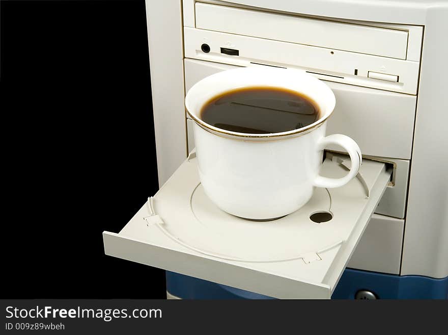 Cup of black coffee on CD-ROM, isolated on black