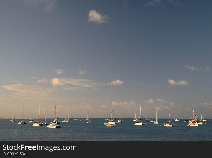 Sailboats on whitsunday beach - australia shot at sunset. Sailboats on whitsunday beach - australia shot at sunset