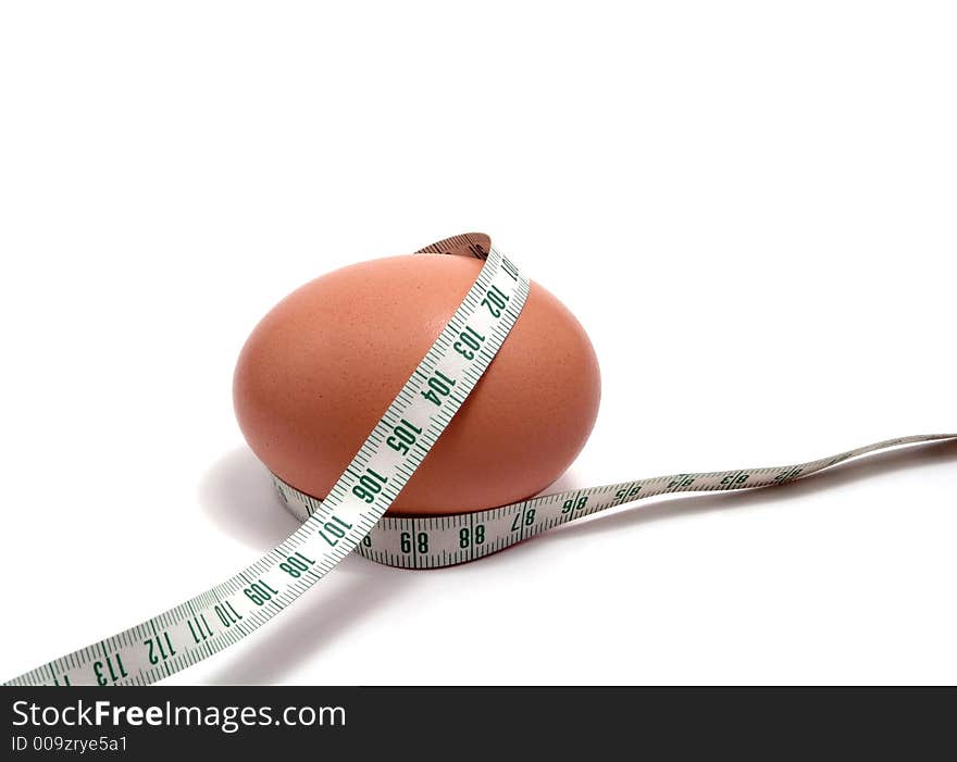 Measurement tape wrapped around the egg, nutrition concept