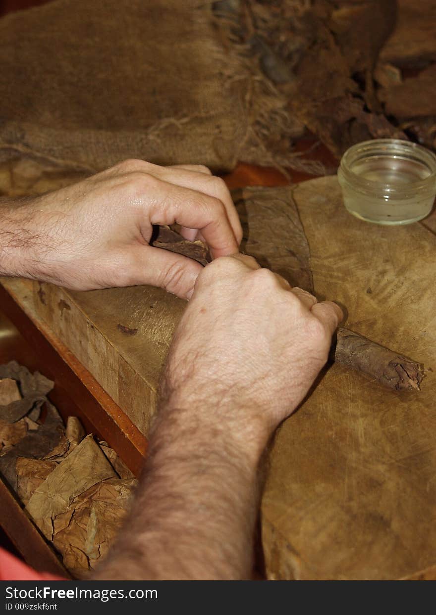 A cuban craftsman working the tobacco leaves