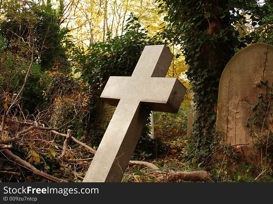 Striking religious cross in graveyard. Striking religious cross in graveyard