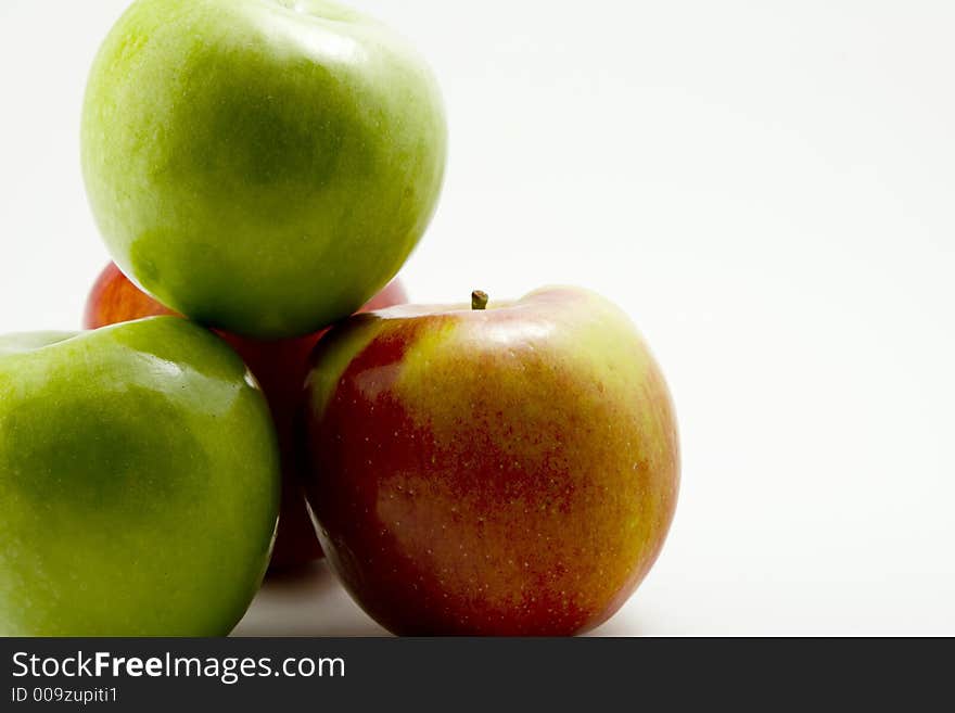 Red and Green Apples on a white background.