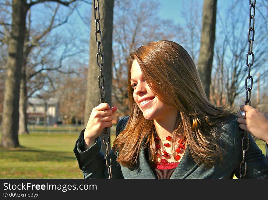 Young woman on the swings. Young woman on the swings