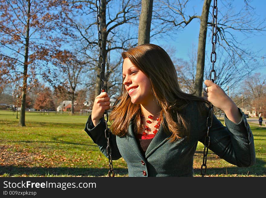 Young woman on the swings. Young woman on the swings