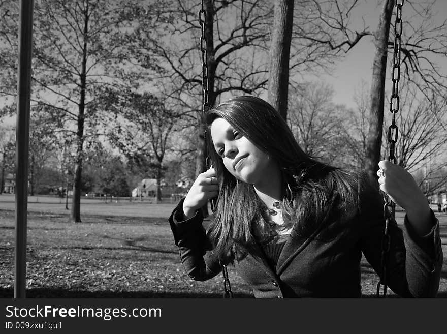 Young woman on the swings. Young woman on the swings