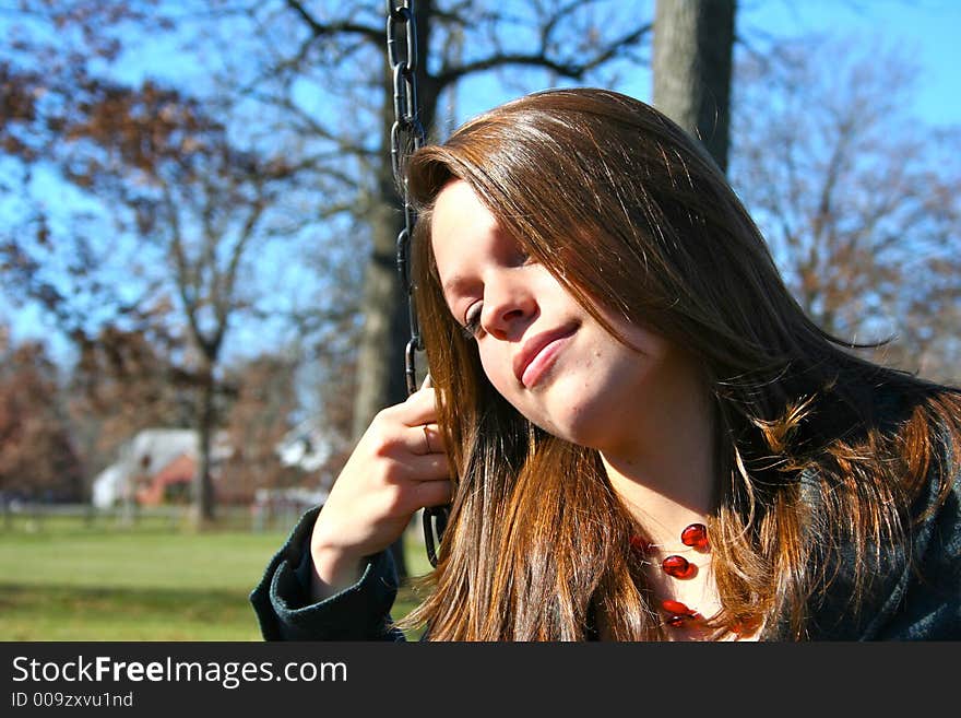 Young woman on the swings. Young woman on the swings