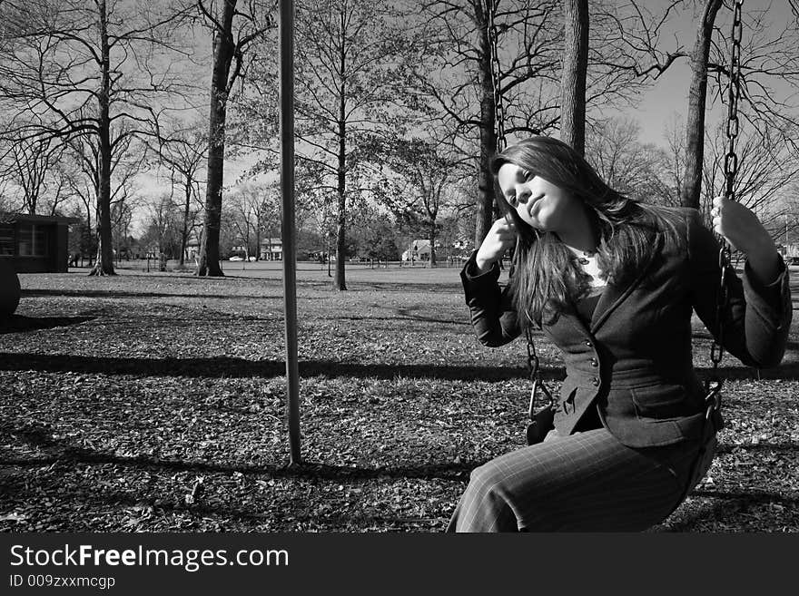 Young woman on the swings. Young woman on the swings