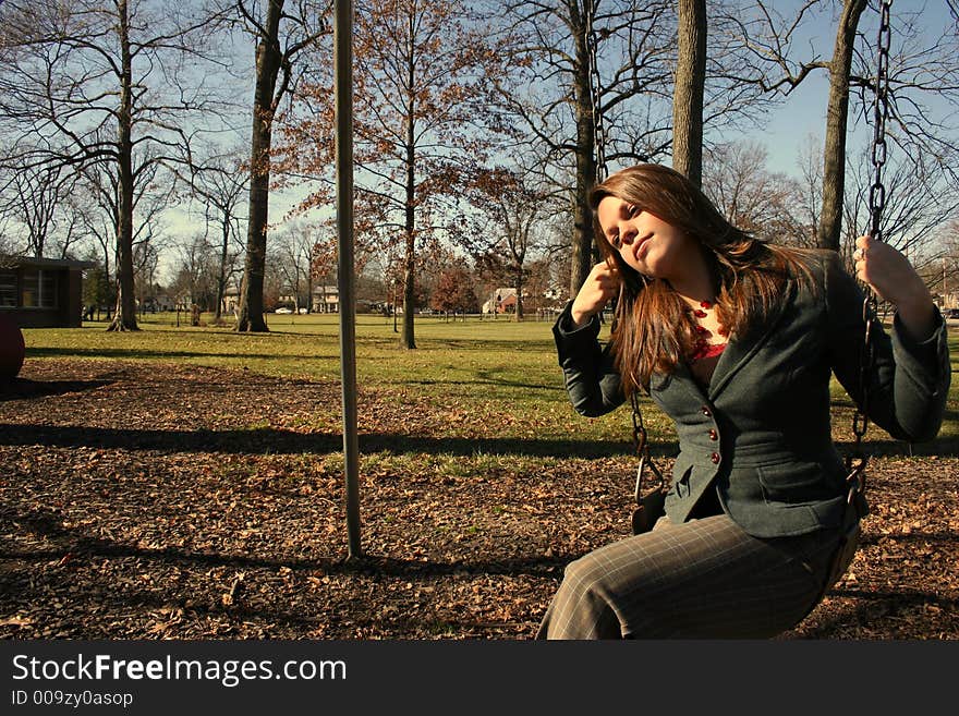 Young woman on the swings. Young woman on the swings