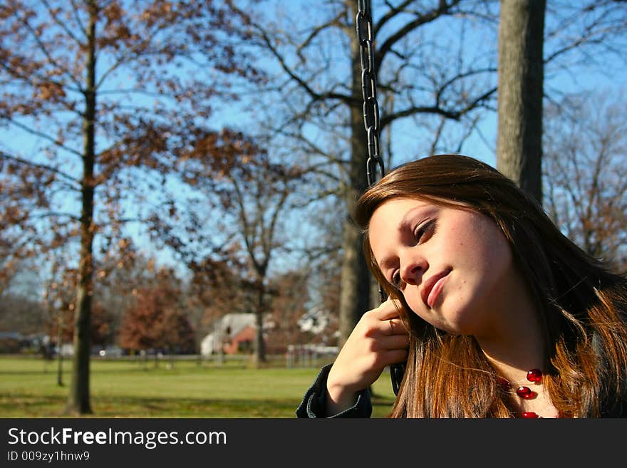 Young woman on the swings. Young woman on the swings