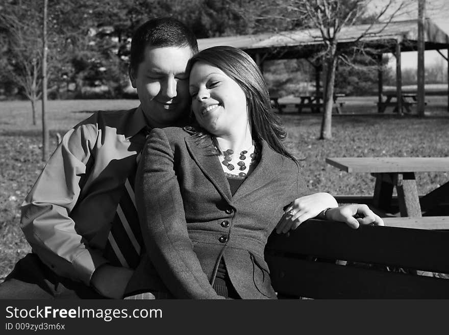 Young couple on park bench. Young couple on park bench