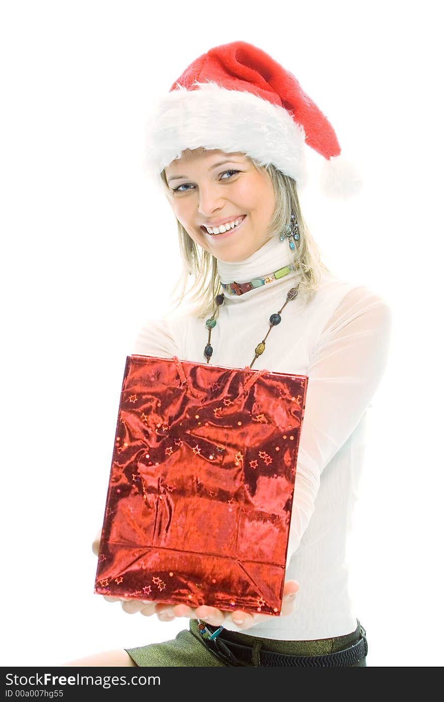 Beauty blonde girl in santa cap with christmas gift