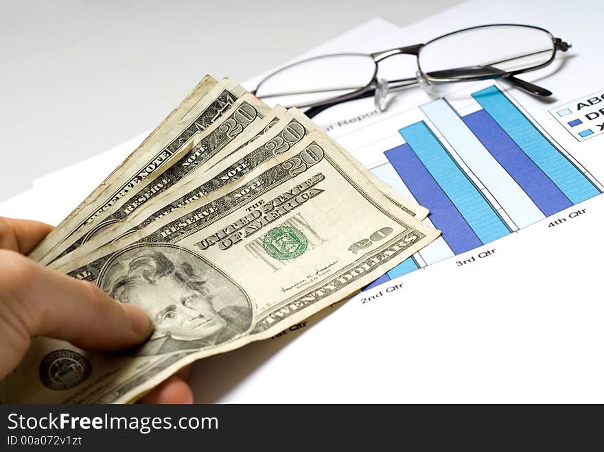 Graph chart with hand holding money. Graph chart with hand holding money