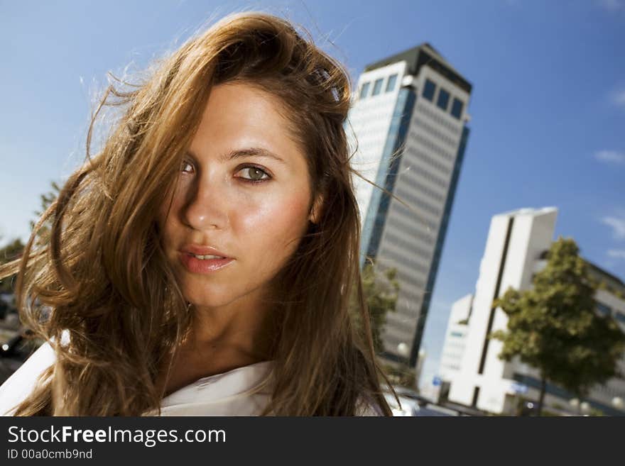 Young businesswoman in front of a building. Young businesswoman in front of a building