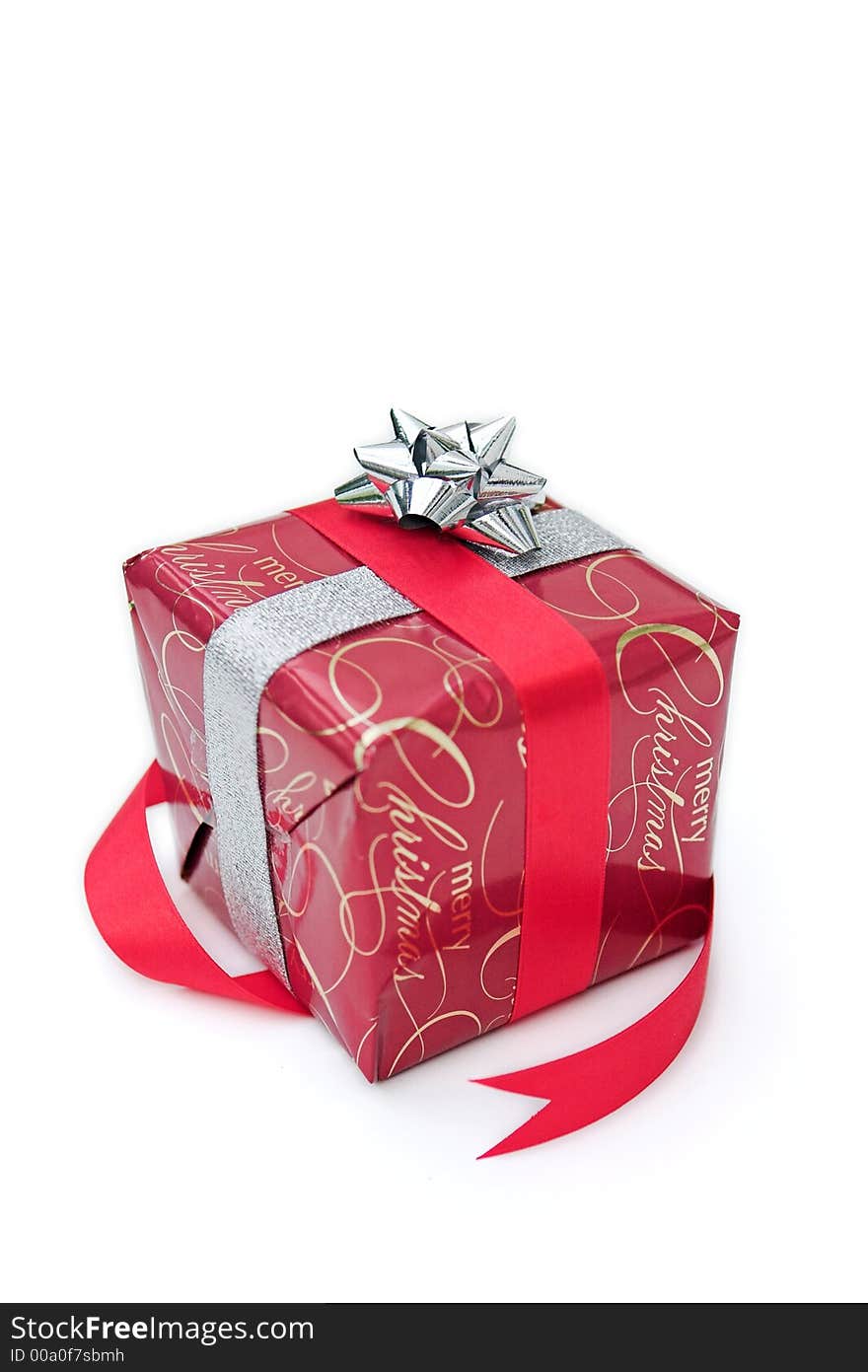 Christmas present all wrapped up with red & silver ribbon & a shiny bow!. Christmas present all wrapped up with red & silver ribbon & a shiny bow!