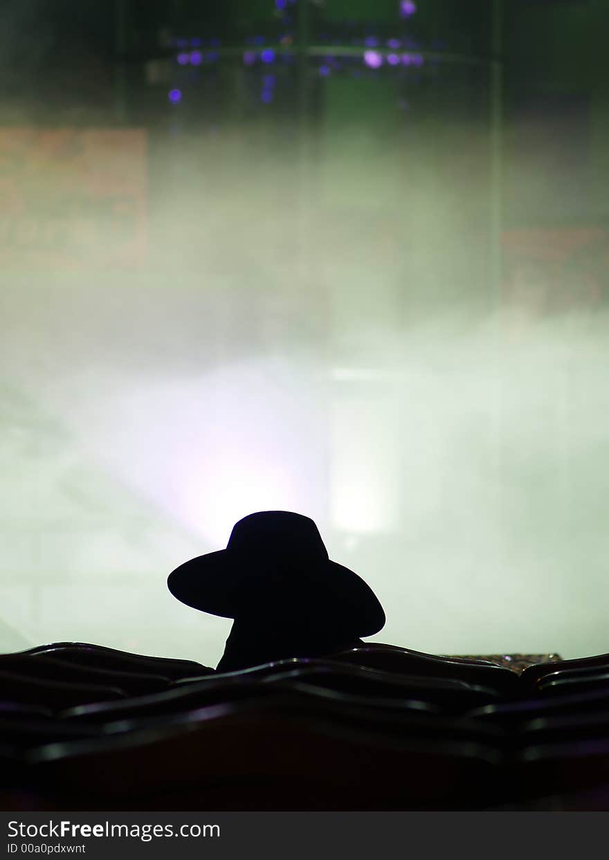 Silhouette of the performer waiting for his turn on the stage