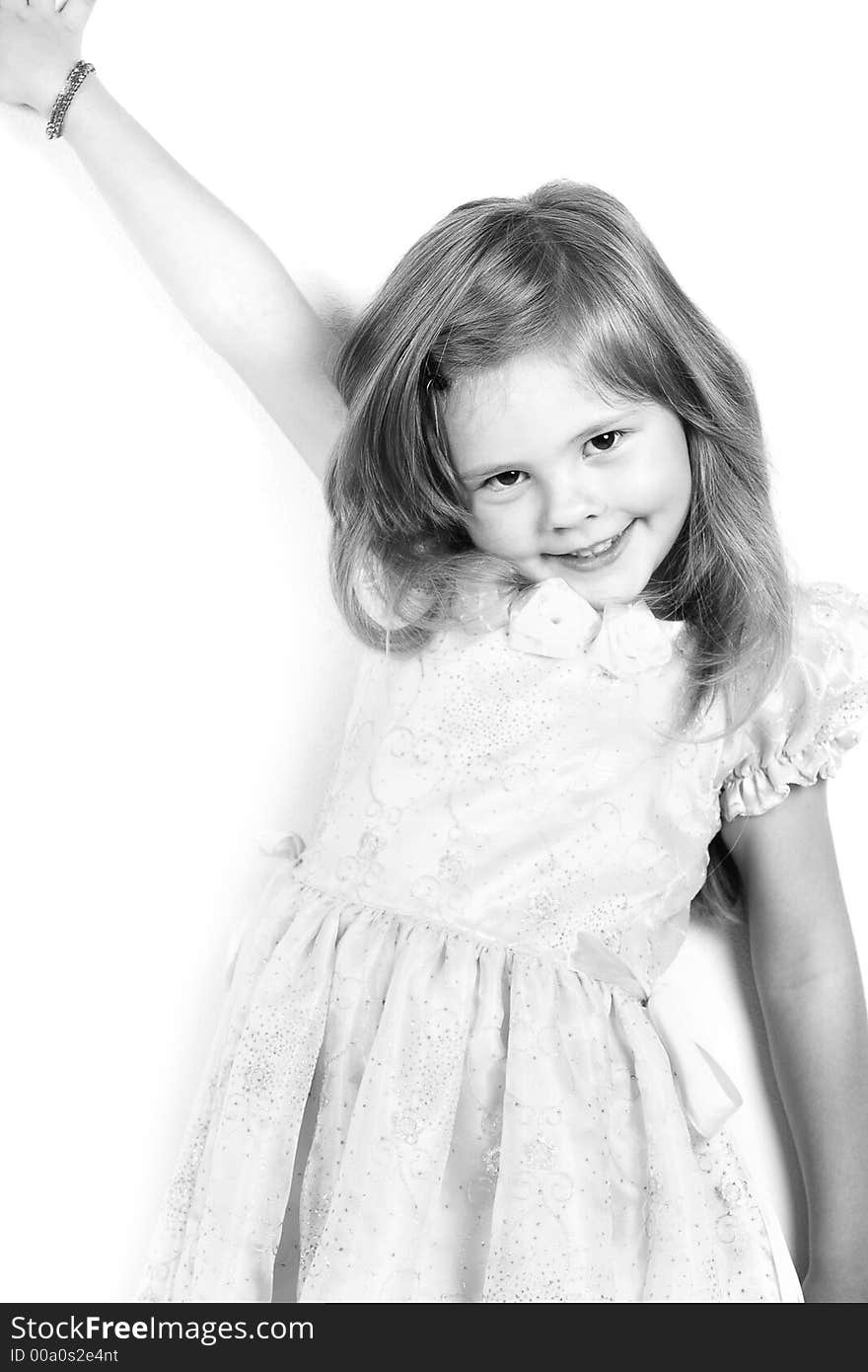 Happy little princess with a beautiful hair. Shot in studio. Happy little princess with a beautiful hair. Shot in studio.