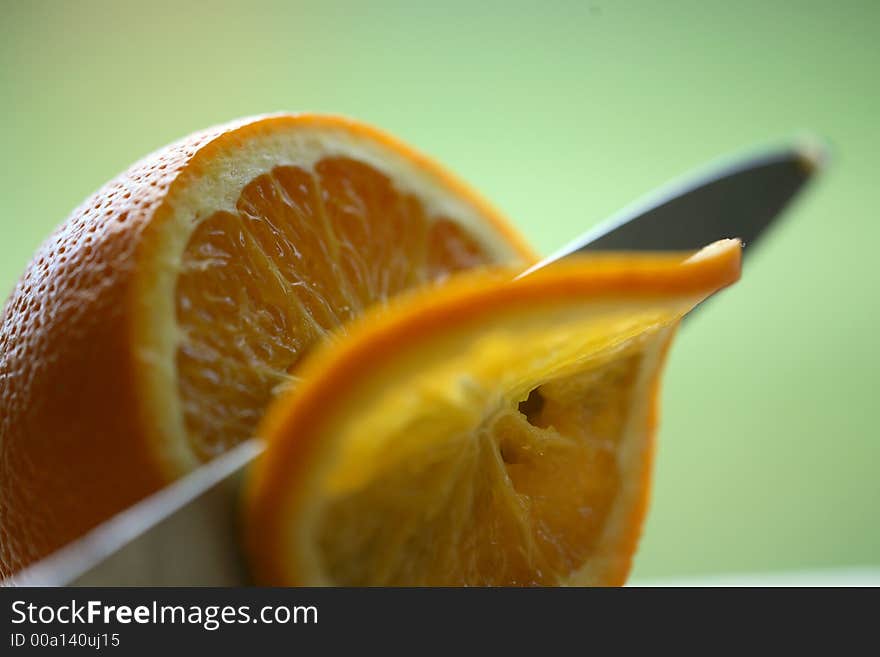 Close up of orange being sliced. Close up of orange being sliced