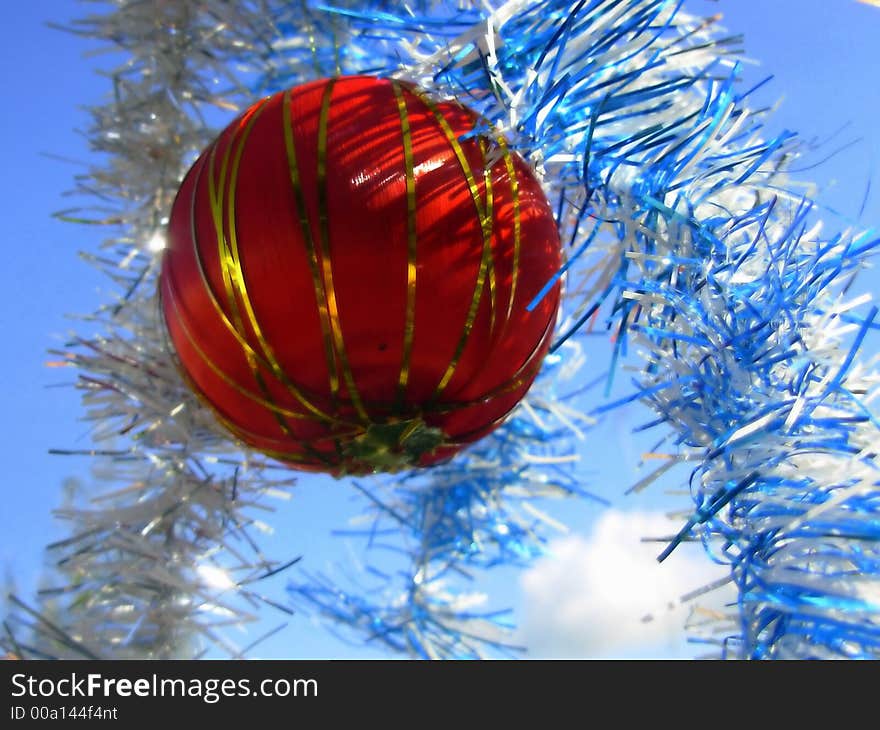 Colorful Christmas balls in blue sky spreaded all over the frame. Colorful Christmas balls in blue sky spreaded all over the frame