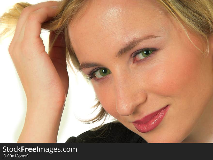 Close up portrait shot of blond girl playing with her hair. Close up portrait shot of blond girl playing with her hair