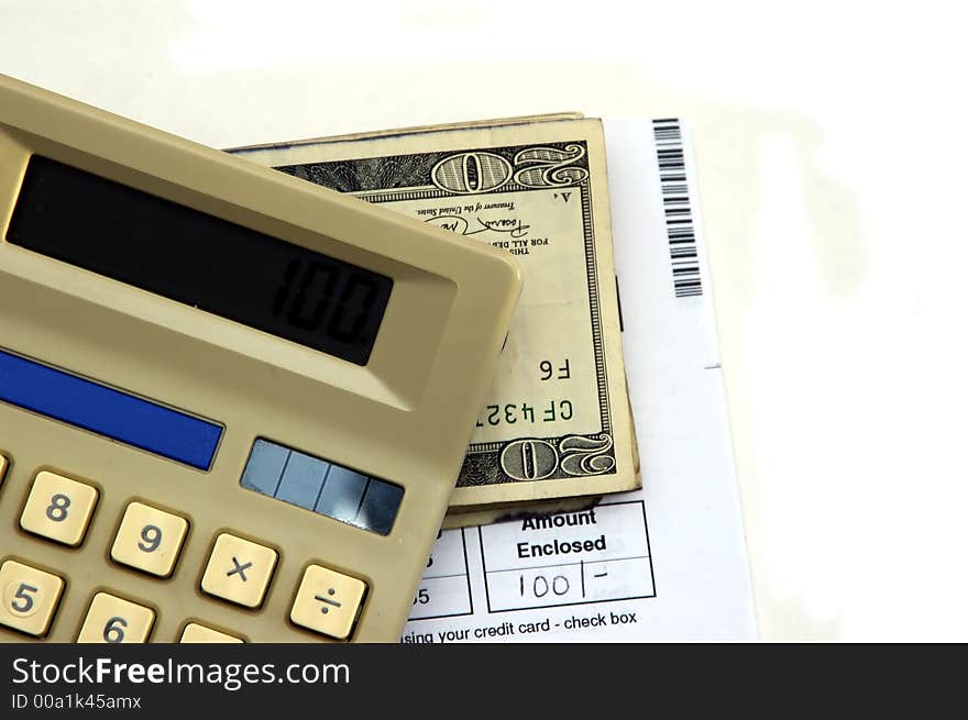 Calculator, bill, pen and cash against a white background. Calculator, bill, pen and cash against a white background