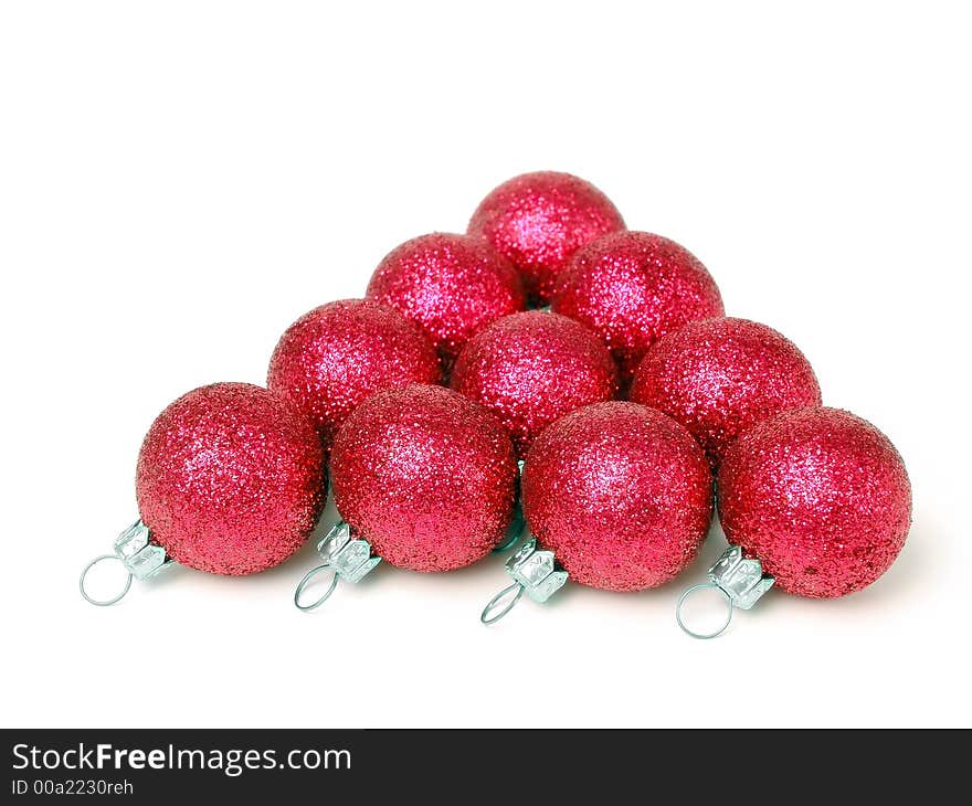 Pyramid of red glistering christmas balls over white background. Pyramid of red glistering christmas balls over white background