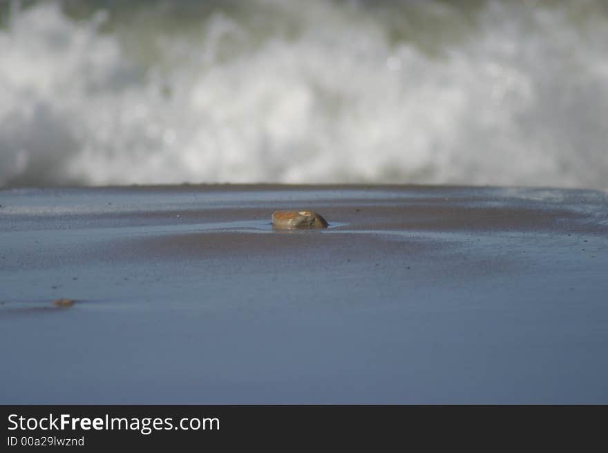 Stone waiting for the wave to hit it. Stone waiting for the wave to hit it...