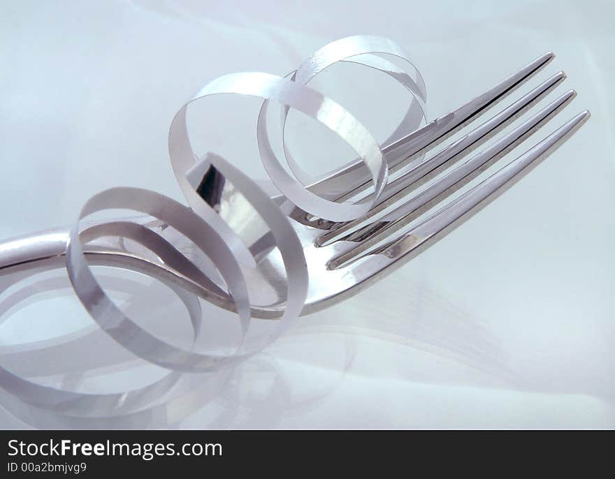 An empty fork with silver ribbon. An empty fork with silver ribbon