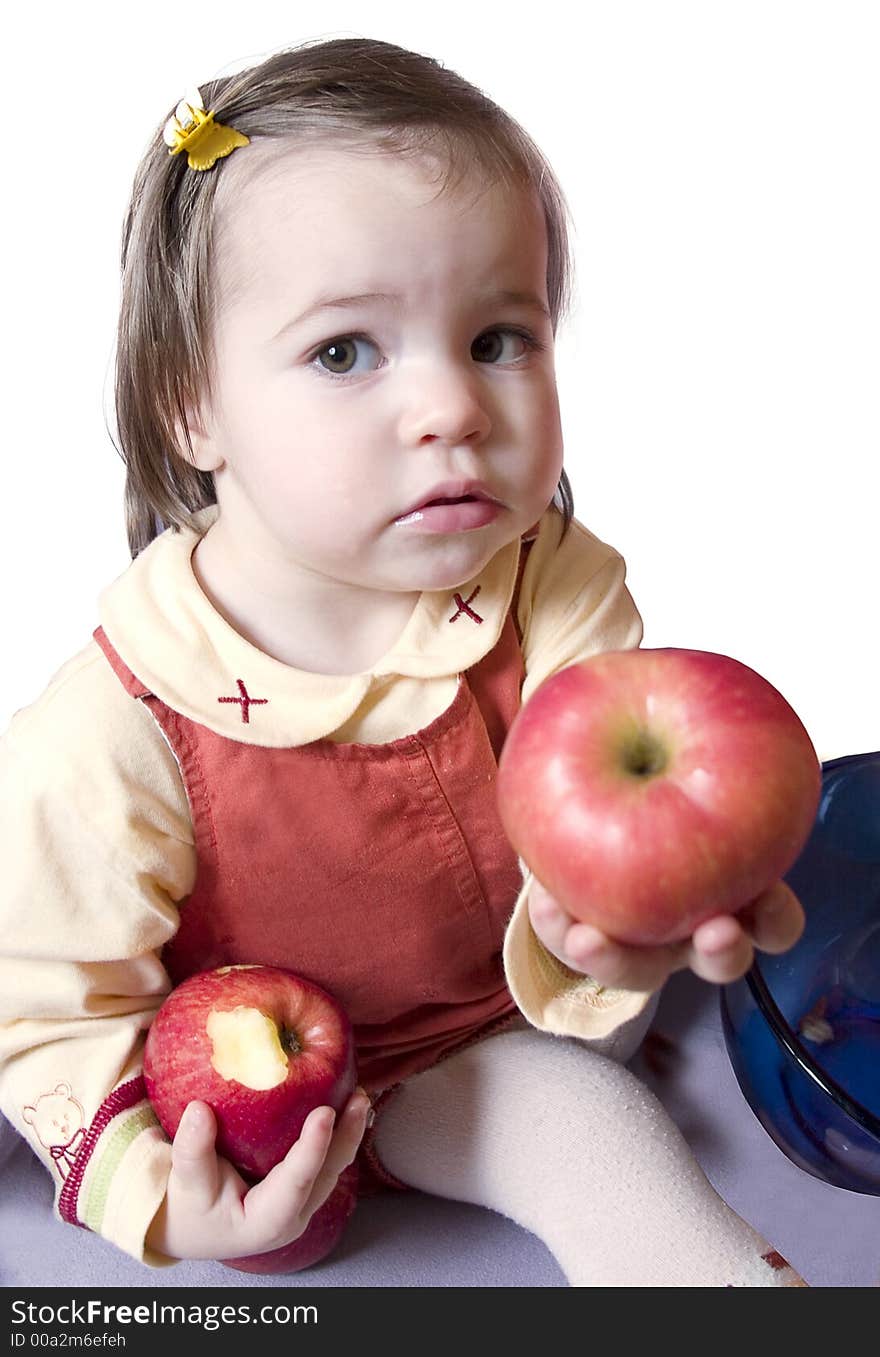 Little cute girl with two apples. Isolated on white background. Little cute girl with two apples. Isolated on white background