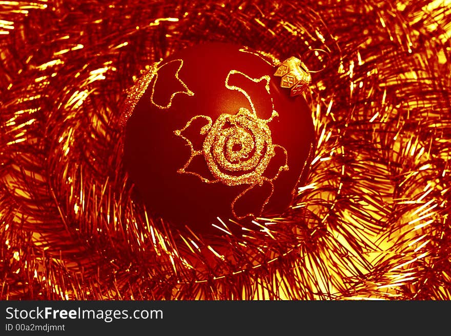 Red christmas ball and shiny spangle, soft-focues closeup. Red christmas ball and shiny spangle, soft-focues closeup