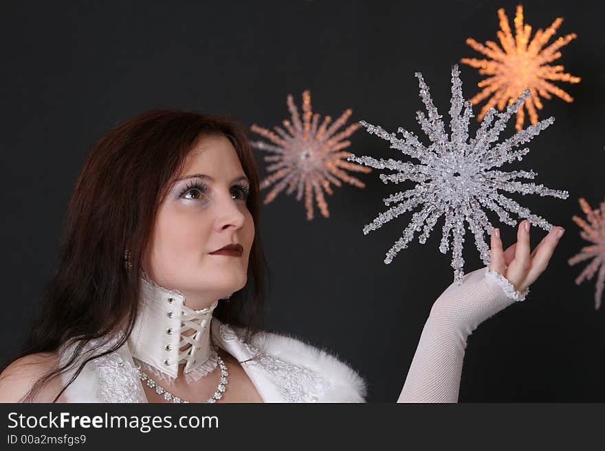 Beautiful girl holding a big crystal star. Beautiful girl holding a big crystal star