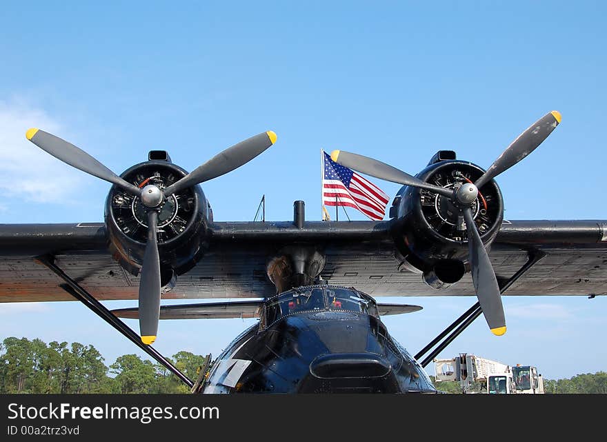 Vintage black seaplane with american flag. Vintage black seaplane with american flag