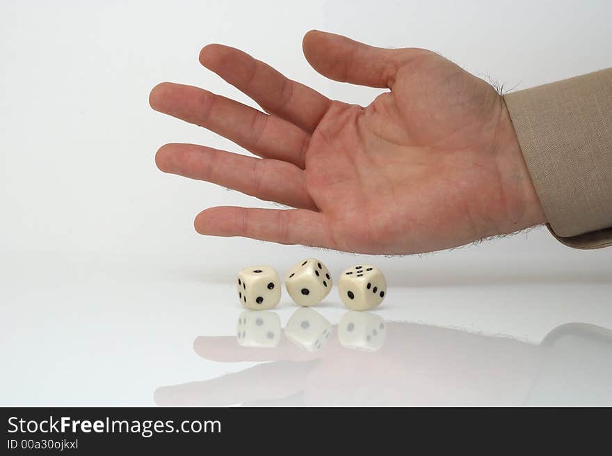 Rolling dice - conceptual photo, white background