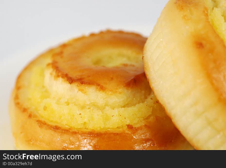 Two Sweet Buns on White Plate. Shallow DOF. Two Sweet Buns on White Plate. Shallow DOF.