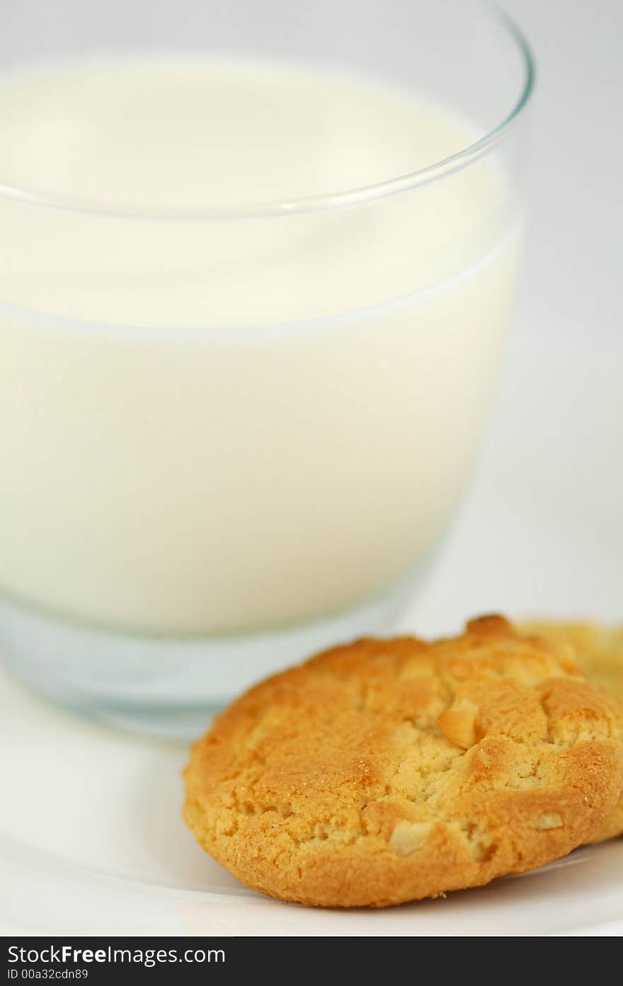 Cookies on White Plate and Glass of Milk. Shallow DOF. Cookies on White Plate and Glass of Milk. Shallow DOF.