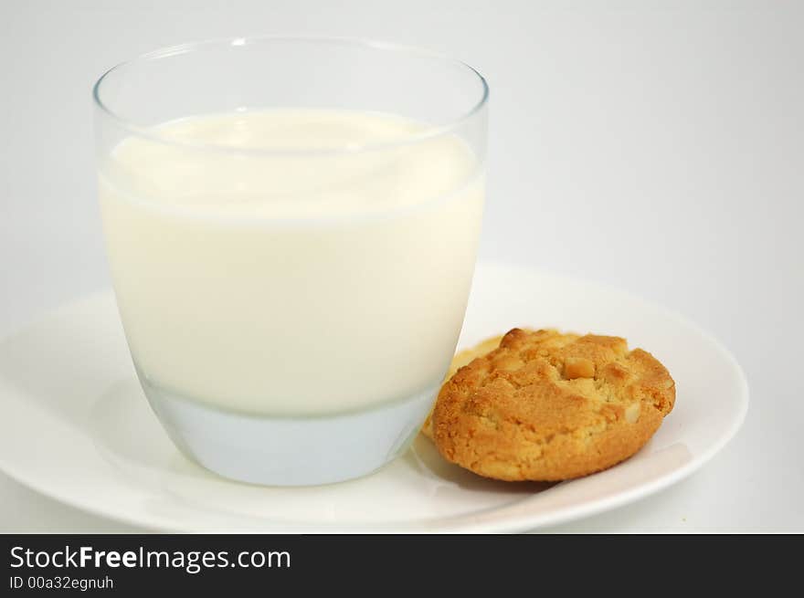 Cookies on White Plate and Glass of Milk. Shallow DOF. Cookies on White Plate and Glass of Milk. Shallow DOF.