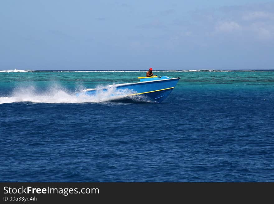 Traditional Tahitian fish boat speeding