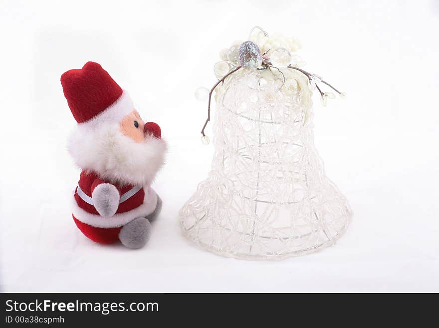 Isolated Santa Claus and white big Christmas bell over white background. Isolated Santa Claus and white big Christmas bell over white background