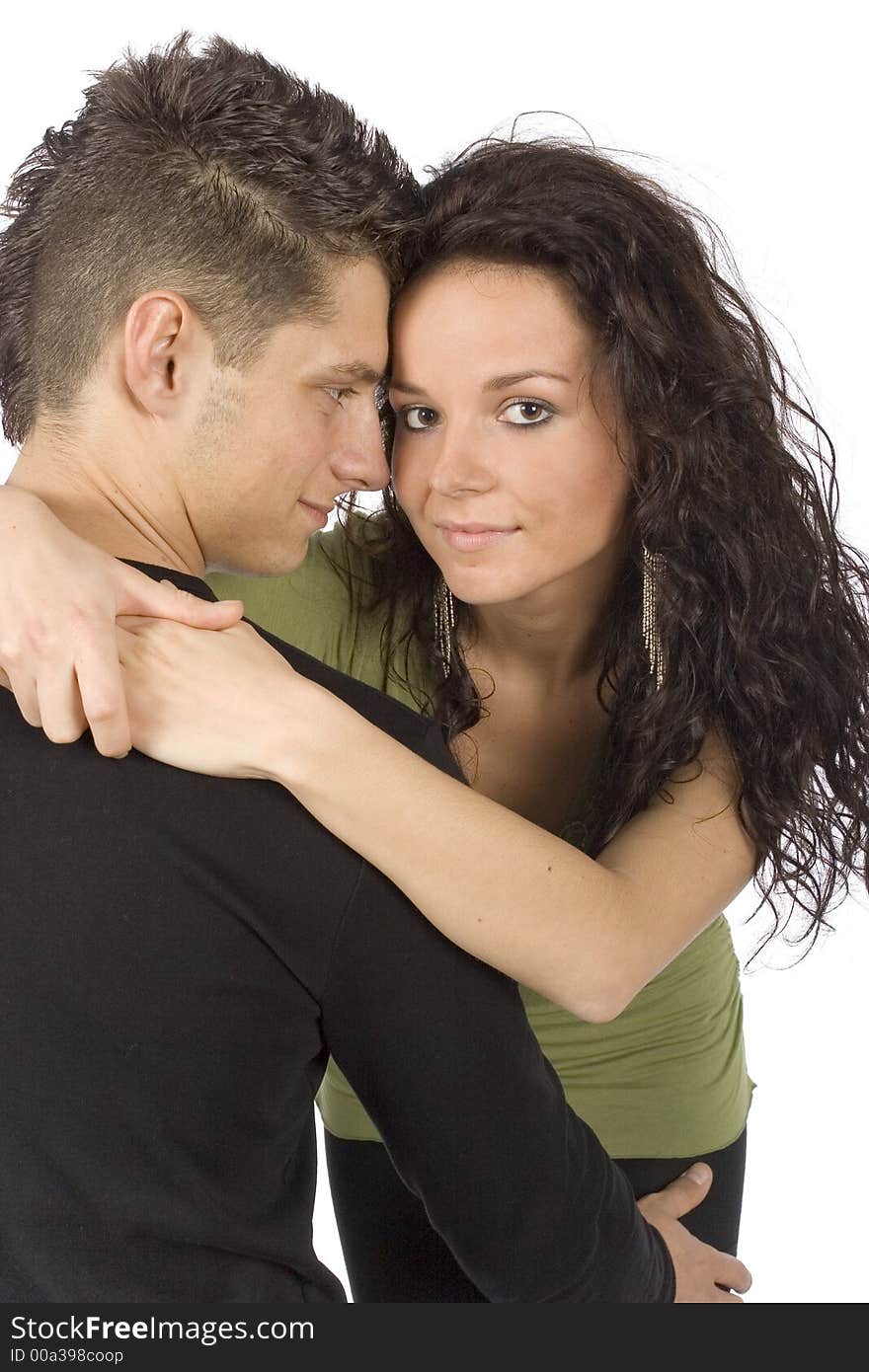 Young snuggling couple on the white background