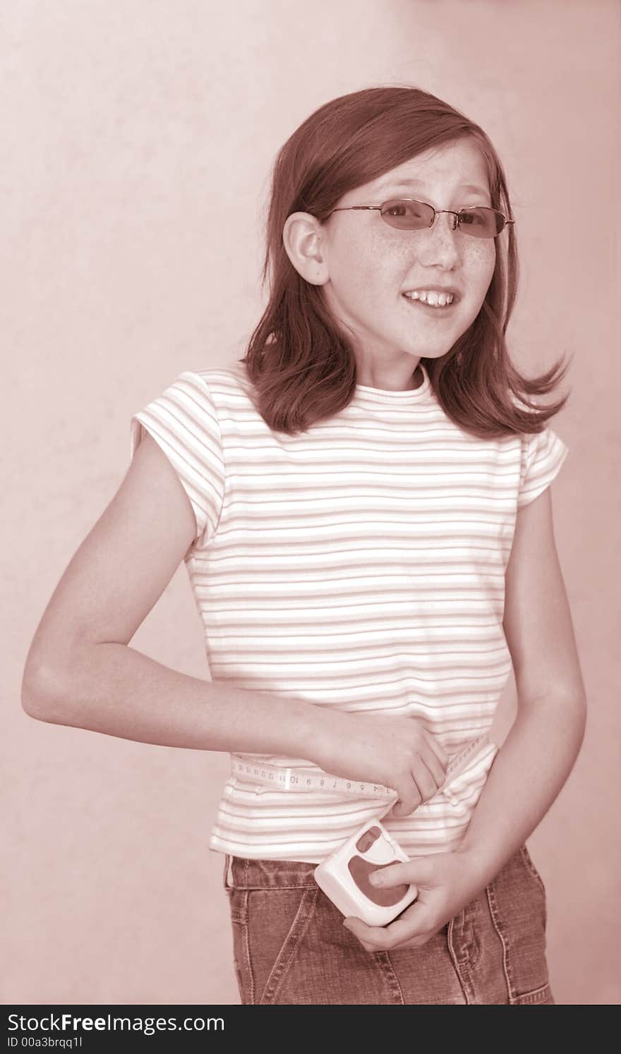 Girl measures her waistline (Sepia). Girl measures her waistline (Sepia)