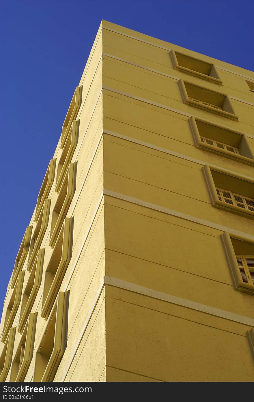 Yellow building on a blue background. Yellow building on a blue background.