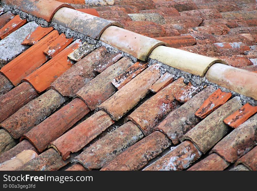 Part of home - old red tiled roof. Part of home - old red tiled roof