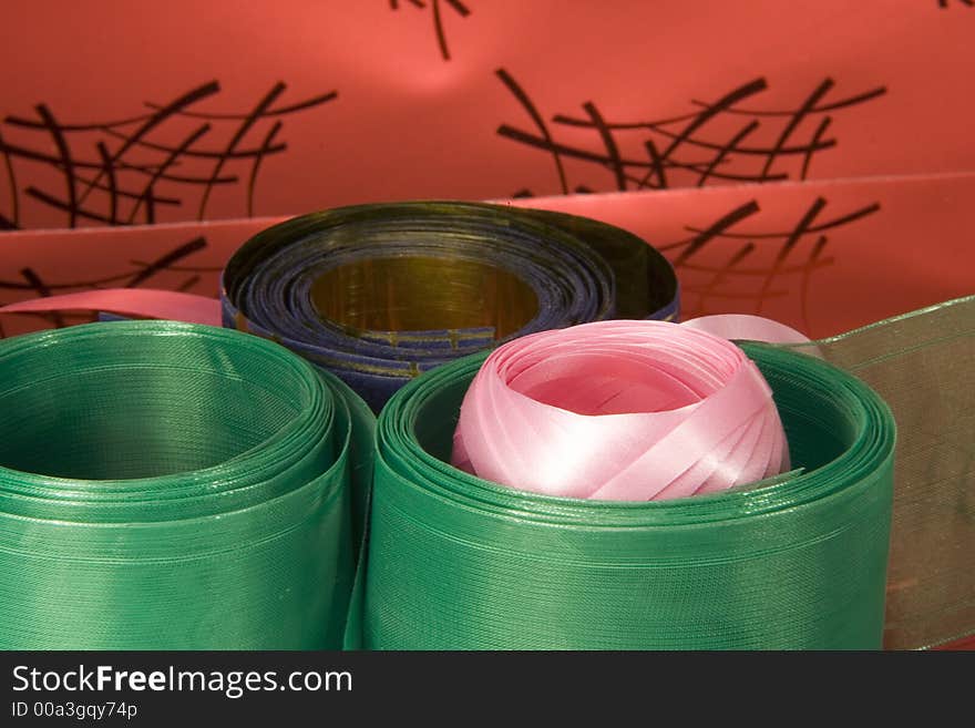 Green, golden and pink gift wrapping ribbons