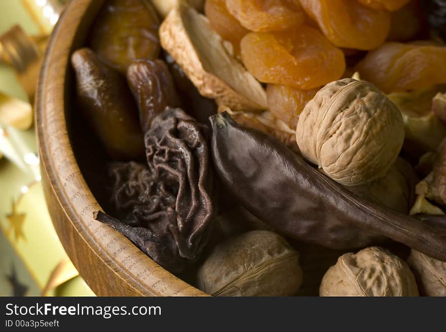 Dry fruit in wooden bowl close up