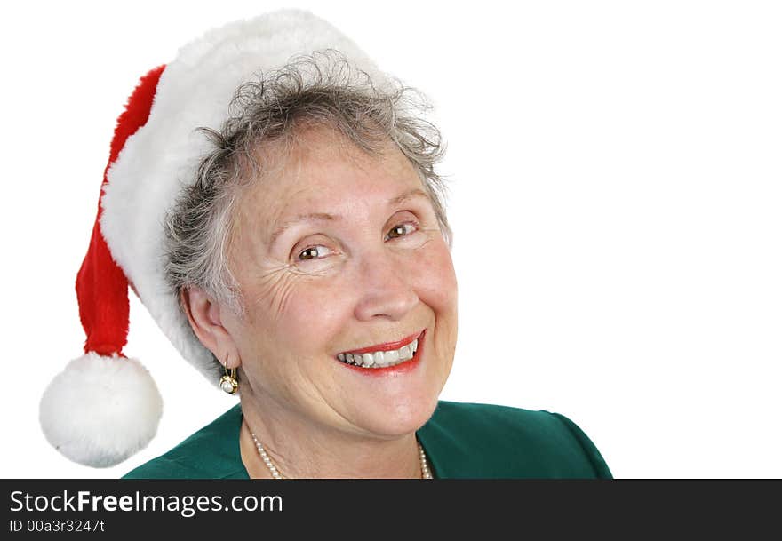 A sweet senior lady in a santa hat, isolated on white. A sweet senior lady in a santa hat, isolated on white