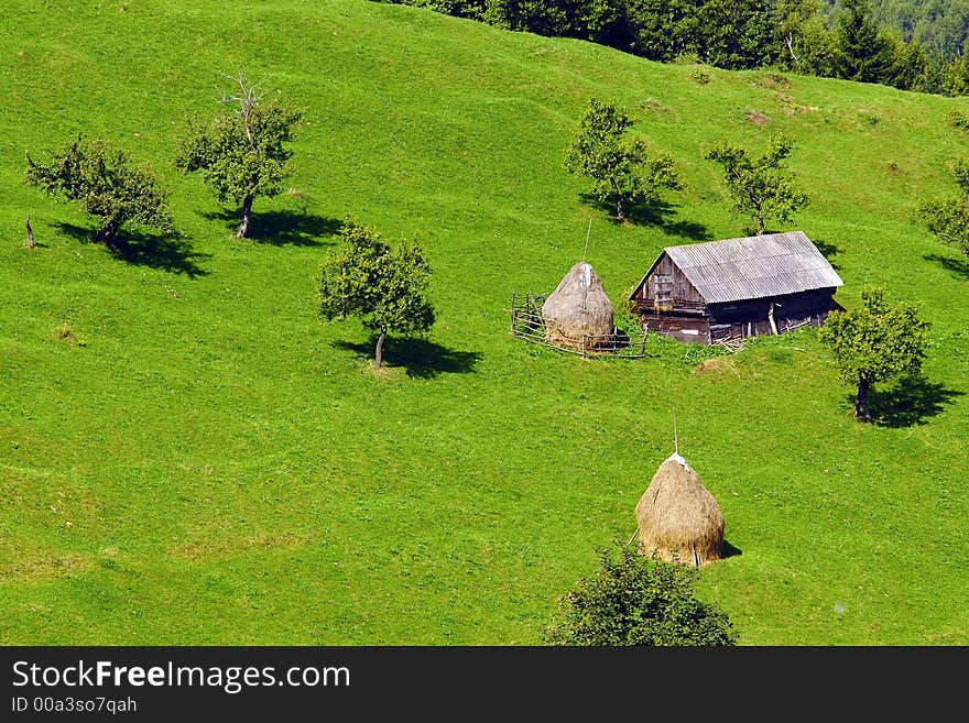 Mountain landscape with shack in a valley. Mountain landscape with shack in a valley