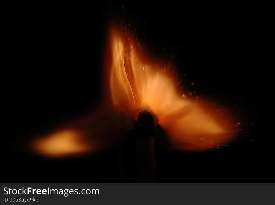 Single match burn on black background, isolated. Single match burn on black background, isolated