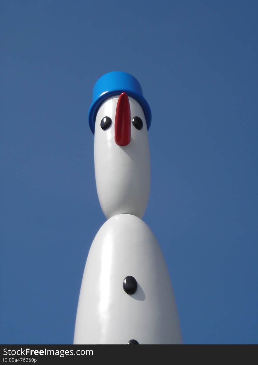 Cute Snowman Against Blue Sky