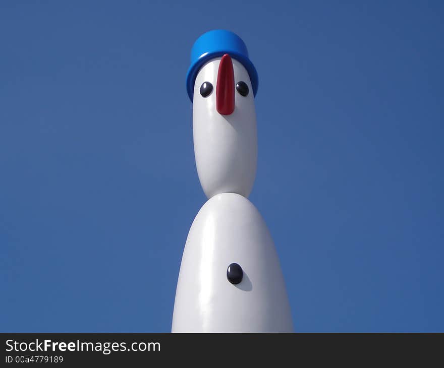 Cute Snowman Against Blue Sky