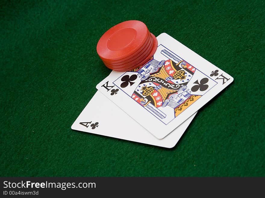 Close up of cards and chips on green felt with winning hand. Close up of cards and chips on green felt with winning hand