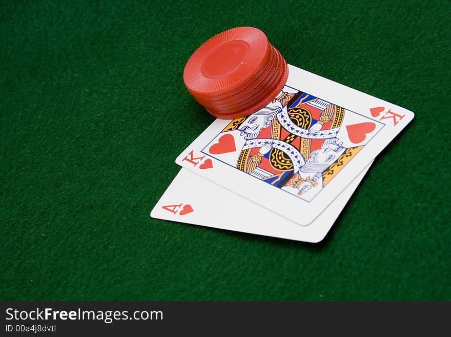 Close up of cards and chips on green felt with winning hand. Close up of cards and chips on green felt with winning hand